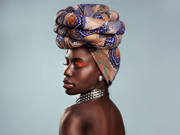 Black woman, profile and African turban, fashion and beauty with makeup isolated on studio background. Natural cosmetics, eyeshadow and female model with traditional head wrap, mockup space and style. - Foto, Imagem