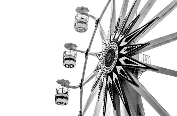 Photograph of the Ferris wheel ride, located in Sunset Park La Libertad, El Salvador. built by president nayib bukele. black and white - Photo, Image