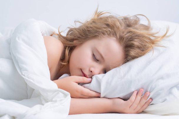 Sweet sleep. Child sleeping on bed at home. Bedtime, kid sleeps. Child boy asleep on soft pillow with blanket - Zdjęcie, obraz