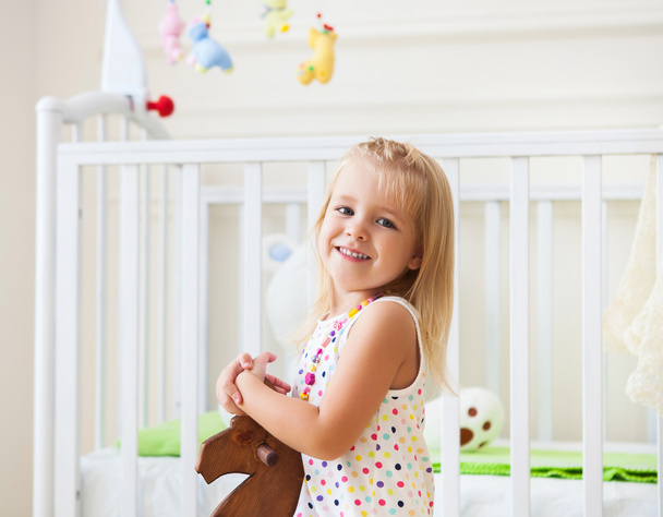 Little cute girl in nursery room  - Foto, imagen