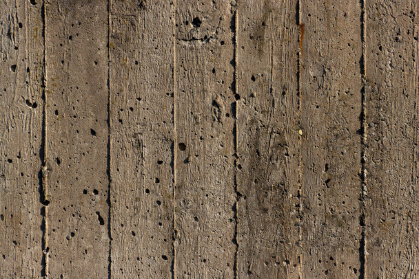 Wooden imprint from formwork in concrete wall for background - 写真・画像