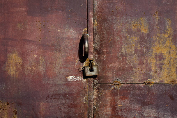 Close up of lock and old metal door - Фото, изображение