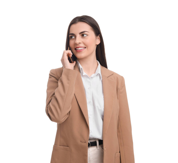 Happy young businesswoman talking on smartphone against white background - Zdjęcie, obraz