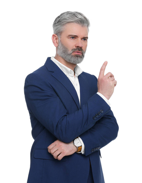 Mature businessman in stylish clothes posing on white background - Фото, изображение