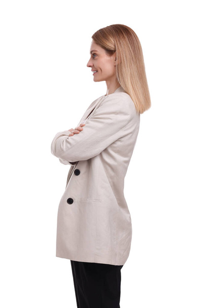 Beautiful happy businesswoman crossing arms on white background - Fotografie, Obrázek
