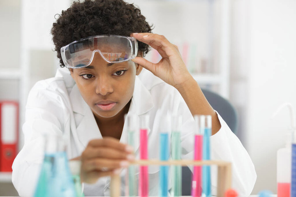chemical laboratory worker looking at results - Foto, Bild