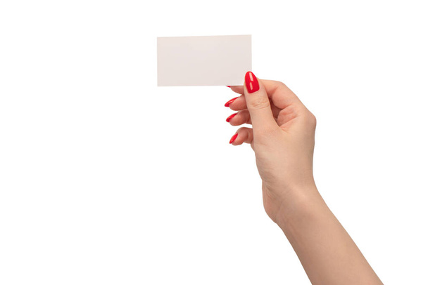 Empty card in woman hand with red nails  isolated on a white background. Copy space.  - Foto, Imagem