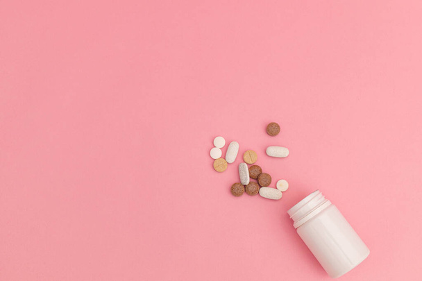 Medicine with pills on pink background - Photo, image