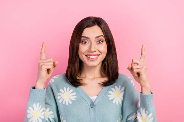 Photo of adorable funky woman dressed teal outfit pointing two fingers up empty space isolated pink color background. - Foto, Imagen