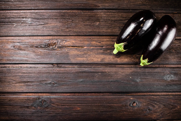 Fresh homemade eggplant on the table. On a wooden background. High quality photo - Foto, Bild
