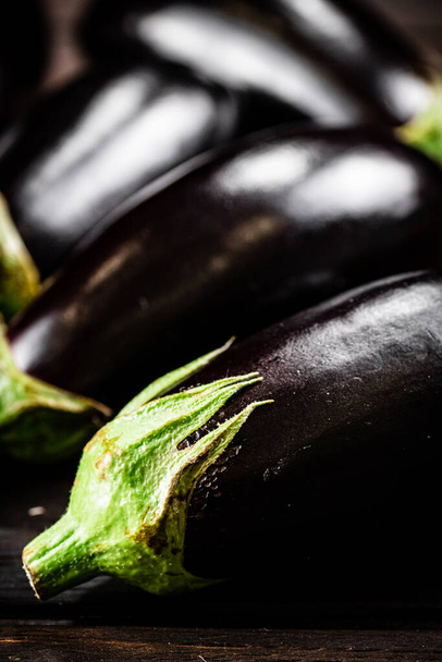 Fresh homemade eggplant on the table. On a wooden background. High quality photo - Foto, afbeelding