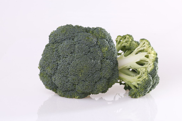 Broccoli vegetable on grey - Photo, image