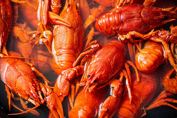 Crayfish are boiled in a pot in water. Macro background. High quality photo - Foto, Imagem