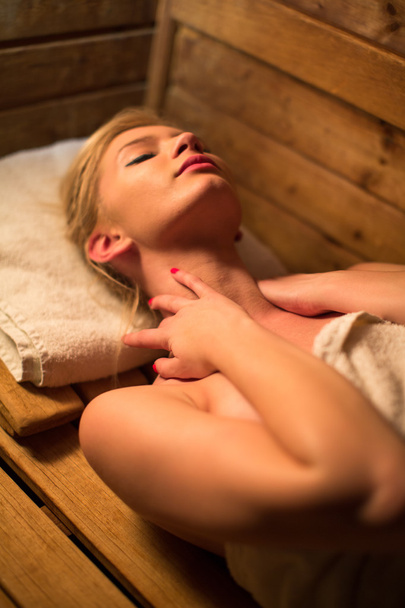 Woman relaxing in a sauna - Foto, imagen