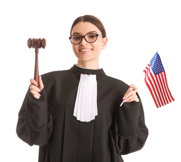 Female judge with gavel and USA flag on white background - Φωτογραφία, εικόνα