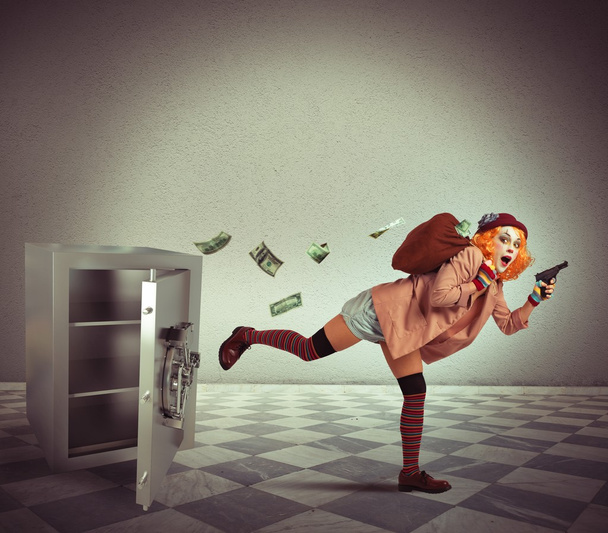Pajac kradnie pieniądze z kasa - Zdjęcie, obraz