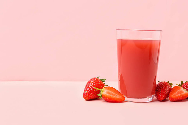 Glass of tasty strawberry juice on white table - Photo, Image