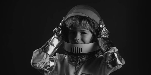Child boy playing with space helmet, little astronaut or spaceman - Фото, зображення
