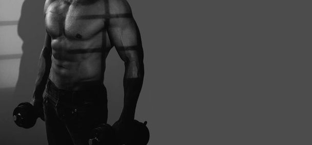 Banner templates with muscular man, muscular torso, six pack abs muscle. Man with Dumbbell. Muscular Bodybuilder Guy Doing Exercises - 写真・画像