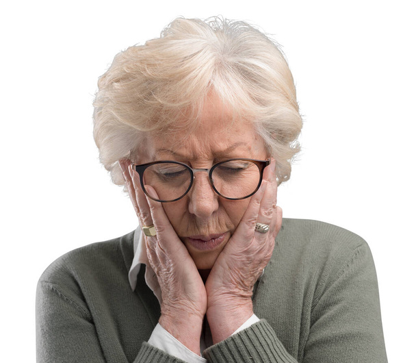 Sad depressed old woman posing with head in hands, she is concerned and lonely - Foto, Imagen