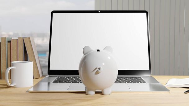 White piggy bank looking at a laptop sat on a desk - Zdjęcie, obraz