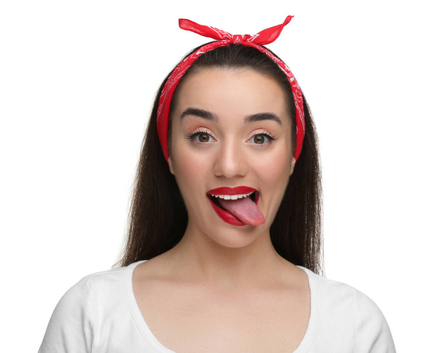 Happy woman showing her tongue on white background - Zdjęcie, obraz