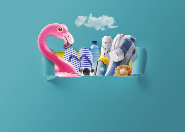 Colorful beach accessories coming out of a ripped hole in the sky, summer vacations concept - 写真・画像