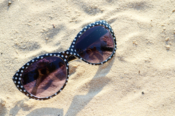 Black and white sunglasses on the shore - Photo, Image