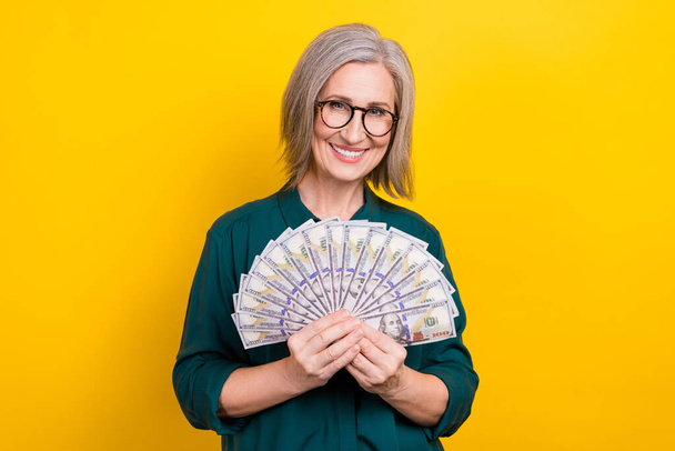 Photo of financier lady hold usd dollars cash fan company earnings isolated on bright color background. - Φωτογραφία, εικόνα