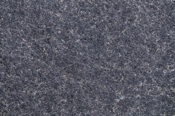 Гранитная поверхность в качестве фона. Глиняная фактура камня. Базальт. Фон поверхности породы - Фото, изображение