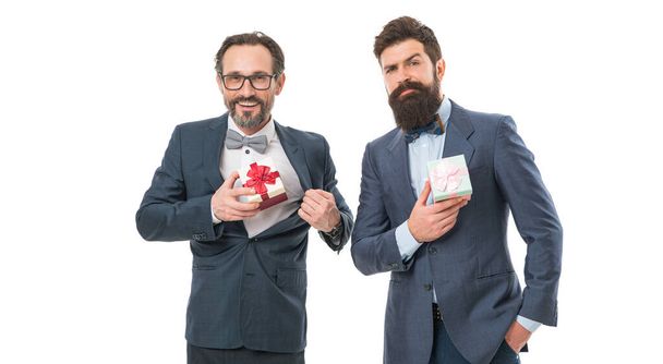 success and reward. esthete. business partners on meeting isolated on white. businessmen in formal suit on party. bearded men hold valentines present. happy birthday shopping. formal men with beard. - Фото, зображення