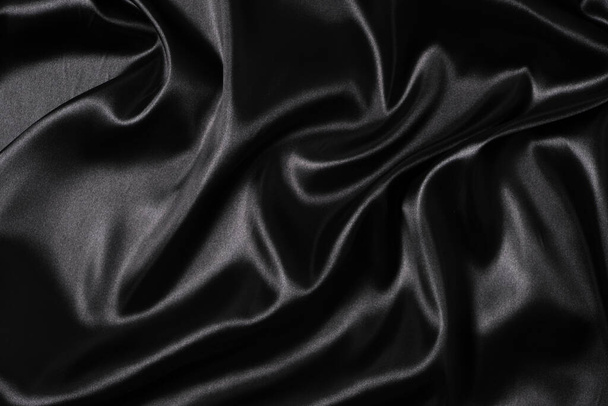 Silk fabric, abstract wavy black satin fabric background - Fotó, kép