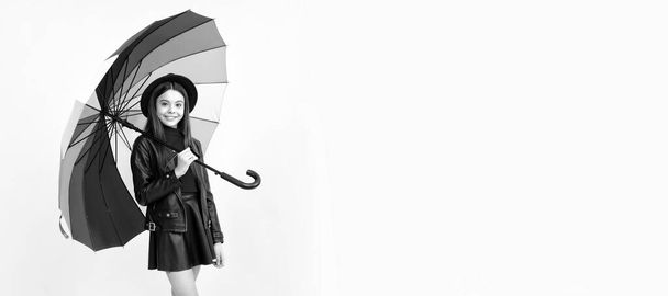 autumn season. rainy weather forecast. back to school. fall fashion accessory. Child with autumn umbrella, rainy weather, horizontal poster, banner with copy space - Фото, изображение