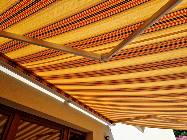 Awnings underline the architectural appearance of your house. Above all, they are able to shade larger areas of terraces, balconies or glass windows. Furthermore, they complete the architectural appearance of the object and become its integral part - Photo, Image