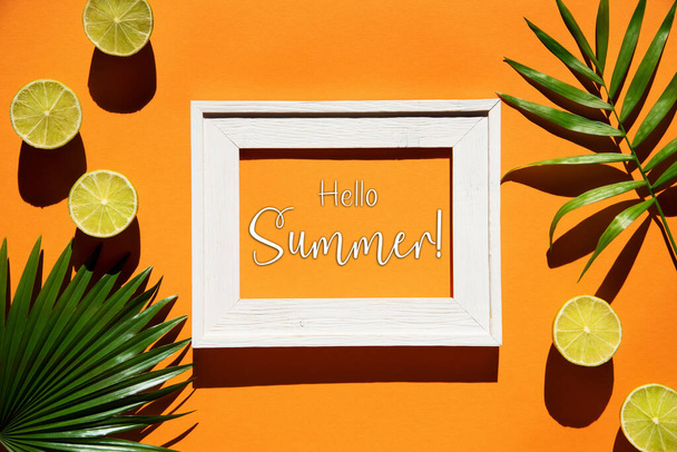 Flat Lay With English Text Hello Summer. Orange Background With Picture Frame And Tropical Lemon And Palm Leaf. - Фото, зображення