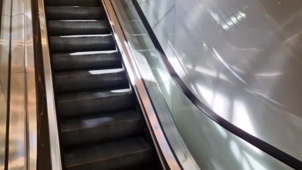 escalator and travelator service and adjustment. lubrication and regular review of the operation of the safety switches that stop the machine in an emergency. when people fall - Footage, Video