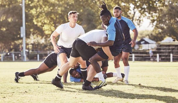 Fitness, rugby and men in tackle on field for match, practice and game in tournament or competition. Sports, teamwork and group of players playing for exercise, training and performance to win ball. - Fotografie, Obrázek