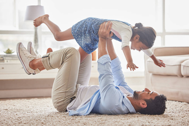 Game, airplane and father with girl on a floor with love, fun and playing in their home together. Happy, flying and child with parent in living room for bonding, relax and enjoying weekend in lounge. - Фото, зображення