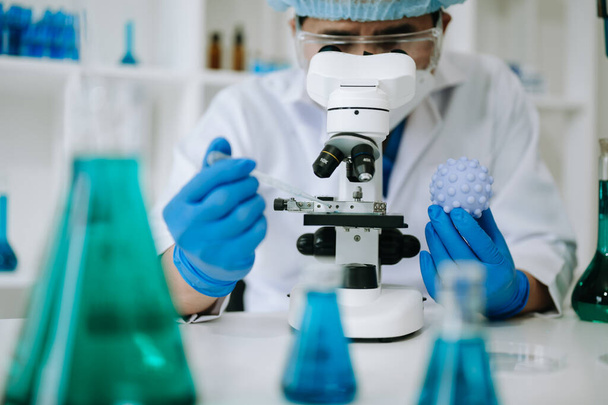Male biotechnologist testing new chemical substances in laboratory. - Fotografie, Obrázek