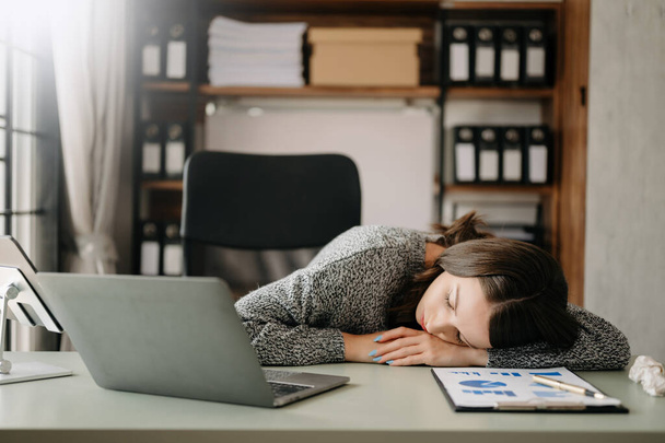  woman feeling migraine .Overworked businesswoman financier while working on laptop  - Photo, Image