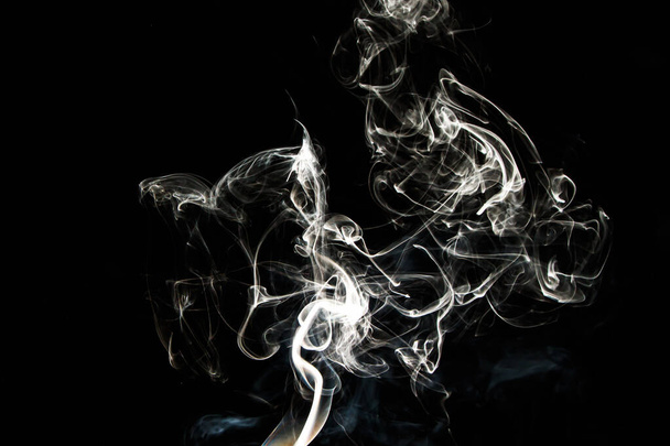 Smoke effect texture. Isolated background. Black and dark backdrop. Smokey fire and mistic effect. Spirit wave. Photo realistic mist stock image. - Foto, afbeelding