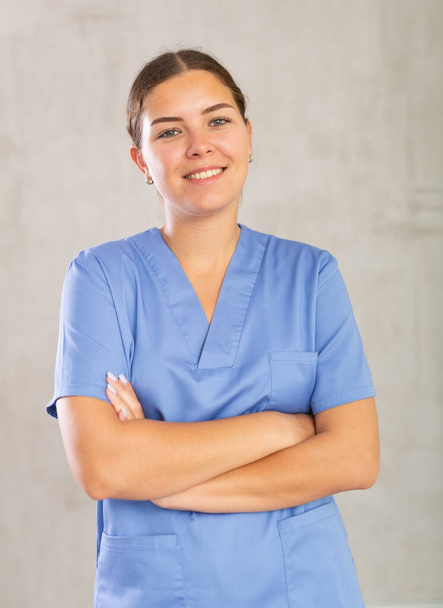 Portrait of young female medic in medical uniform posing in studio.. - Foto, Imagen