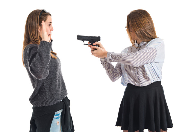 adolescent fille pointant avec un pistolet
 - Photo, image