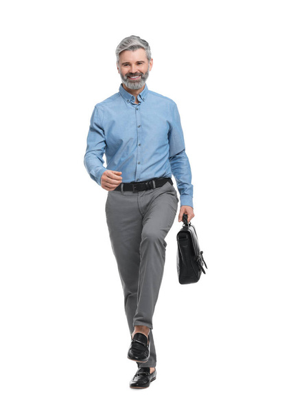 Mature businessman in stylish clothes with briefcase on white background - Valokuva, kuva