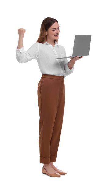 Beautiful businesswoman with laptop on white background - Фото, зображення