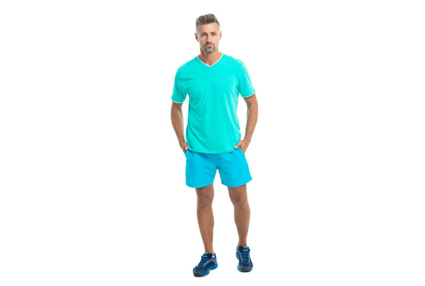 athletic sportsman trainer in sportswear for man to do sport and fitness training in gym isolated on white studio background. - Φωτογραφία, εικόνα