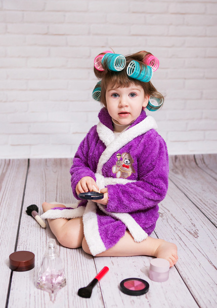 child with curlers in bathrobe - Фото, зображення