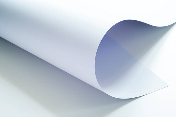 A large sheet of white paper on a light background. - Zdjęcie, obraz