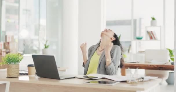 Business woman, laptop and celebrate in office with fist for winning, crypto profit and success at desk. Happy, excited winner and computer in workplace for fintech trading, promotion and competition. - Filmagem, Vídeo