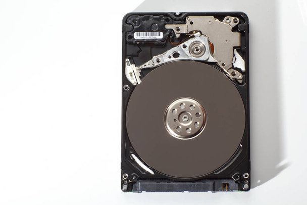A hard drive from a computer without a cover. - Photo, Image